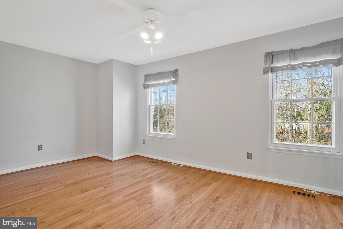 4 Offspring Court Perry Hall, MD 21128 - Photo 15 of 38 a view of an empty room with wooden floor and a window