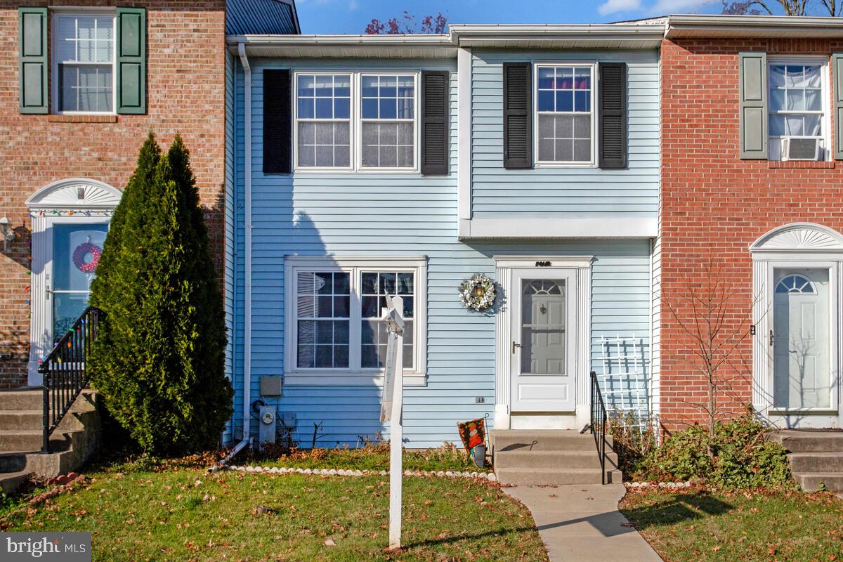 4 Offspring Court Perry Hall, MD 21128 - Photo 2 of 38 a front view of a house with garden