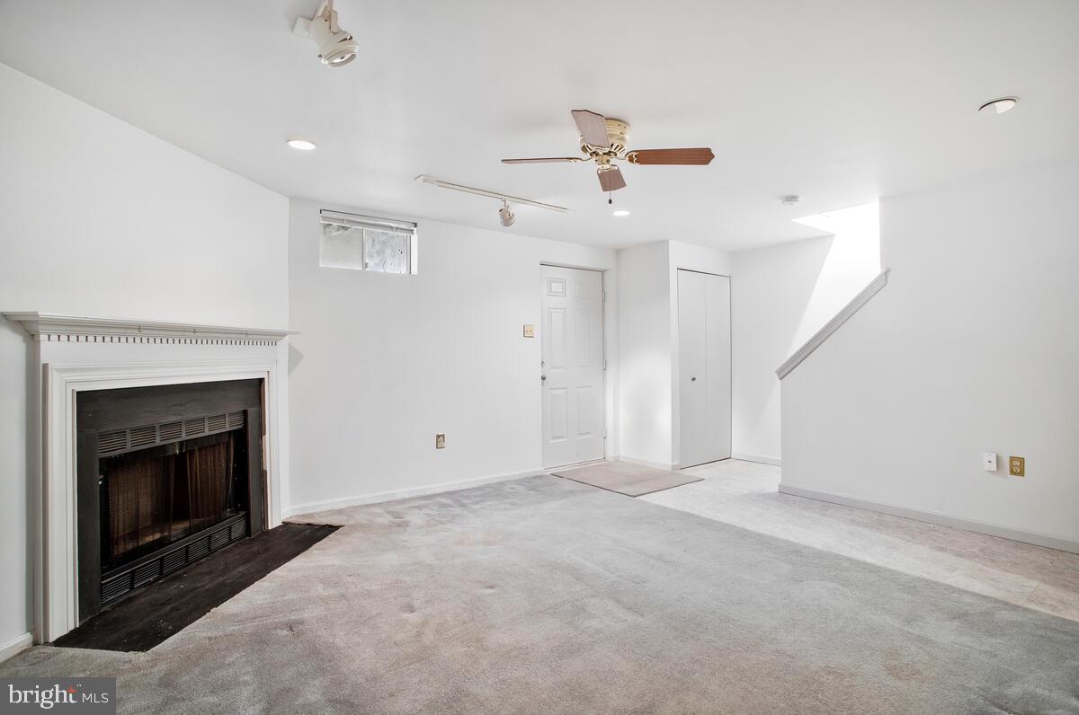 4 Offspring Court Perry Hall, MD 21128 - Photo 23 of 38 an empty room with windows and fireplace