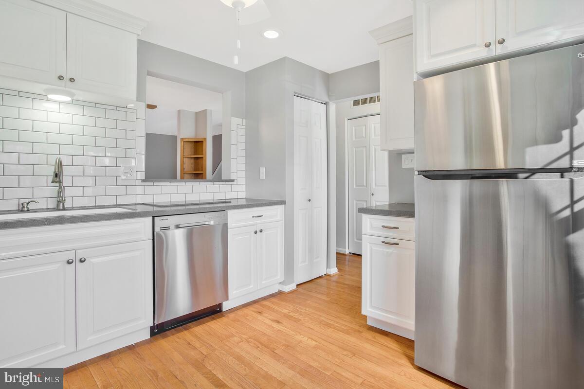 4 Offspring Court Perry Hall, MD 21128 - Photo 6 of 38 a kitchen with stainless steel appliances a refrigerator and a sink