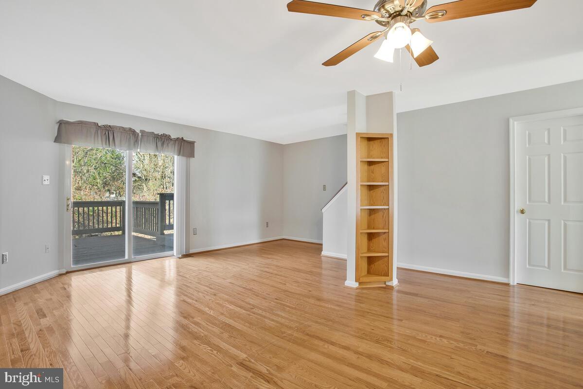 4 Offspring Court Perry Hall, MD 21128 - Photo 7 of 38 a view of an empty room with wooden floor and a window