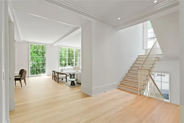 a dining room with furniture and wooden floor