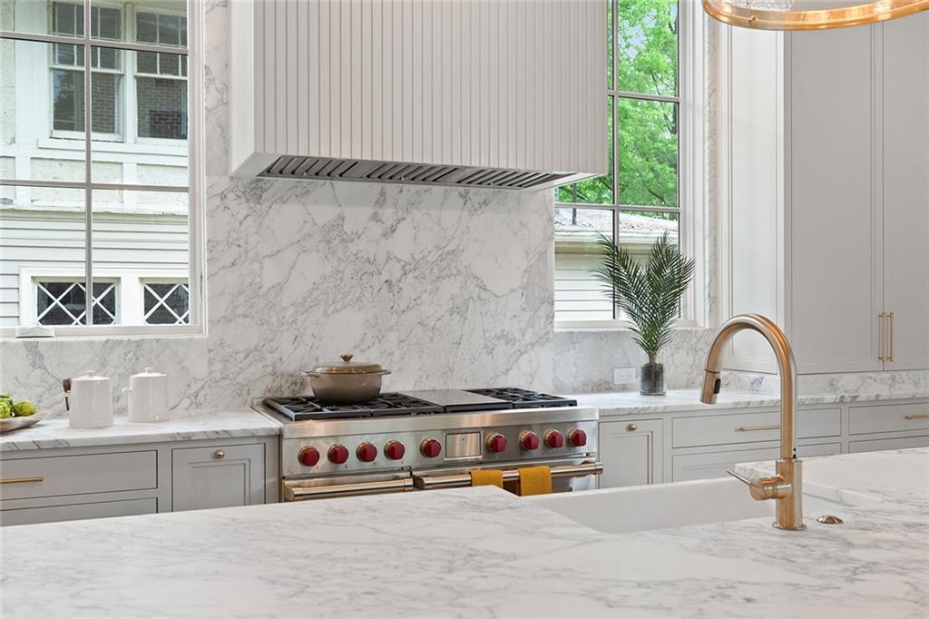 27 Maddox Drive Northeast Atlanta, GA 30309 - Photo 16 of 60 a kitchen with a stove and a sink