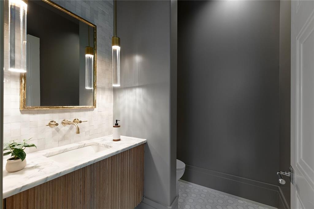 27 Maddox Drive Northeast Atlanta, GA 30309 - Photo 28 of 60 a bathroom with a sink and a mirror