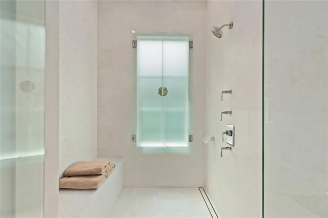 a bathroom with a granite countertop sink a toilet and bathtub