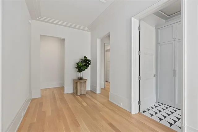 a view of an empty room with a chandelier