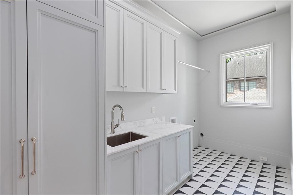 27 Maddox Drive Northeast Atlanta, GA 30309 - Photo 40 of 60 a kitchen with a sink and cabinets