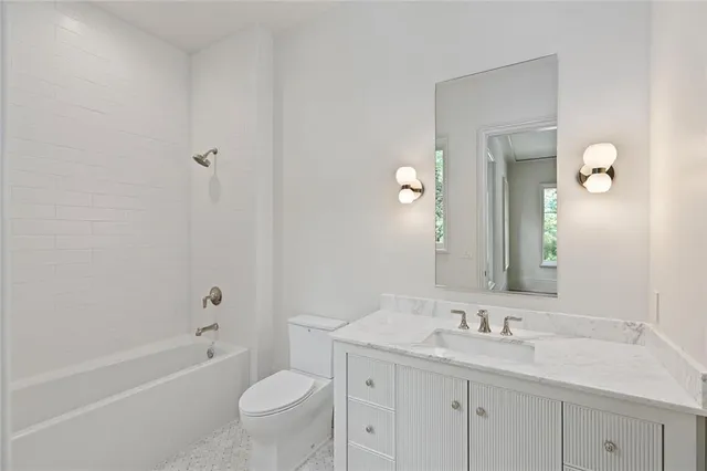 a kitchen with stainless steel appliances a stove and a microwave