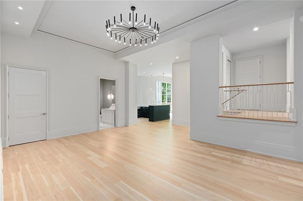 27 Maddox Drive Northeast Atlanta, GA 30309 - Photo 48 of 60 a view of an empty room with a chandelier