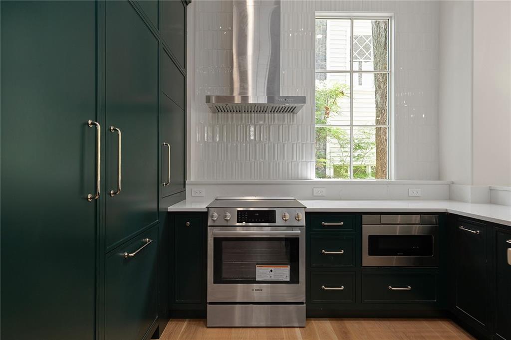 27 Maddox Drive Northeast Atlanta, GA 30309 - Photo 53 of 60 a kitchen with stainless steel appliances a stove and a microwave