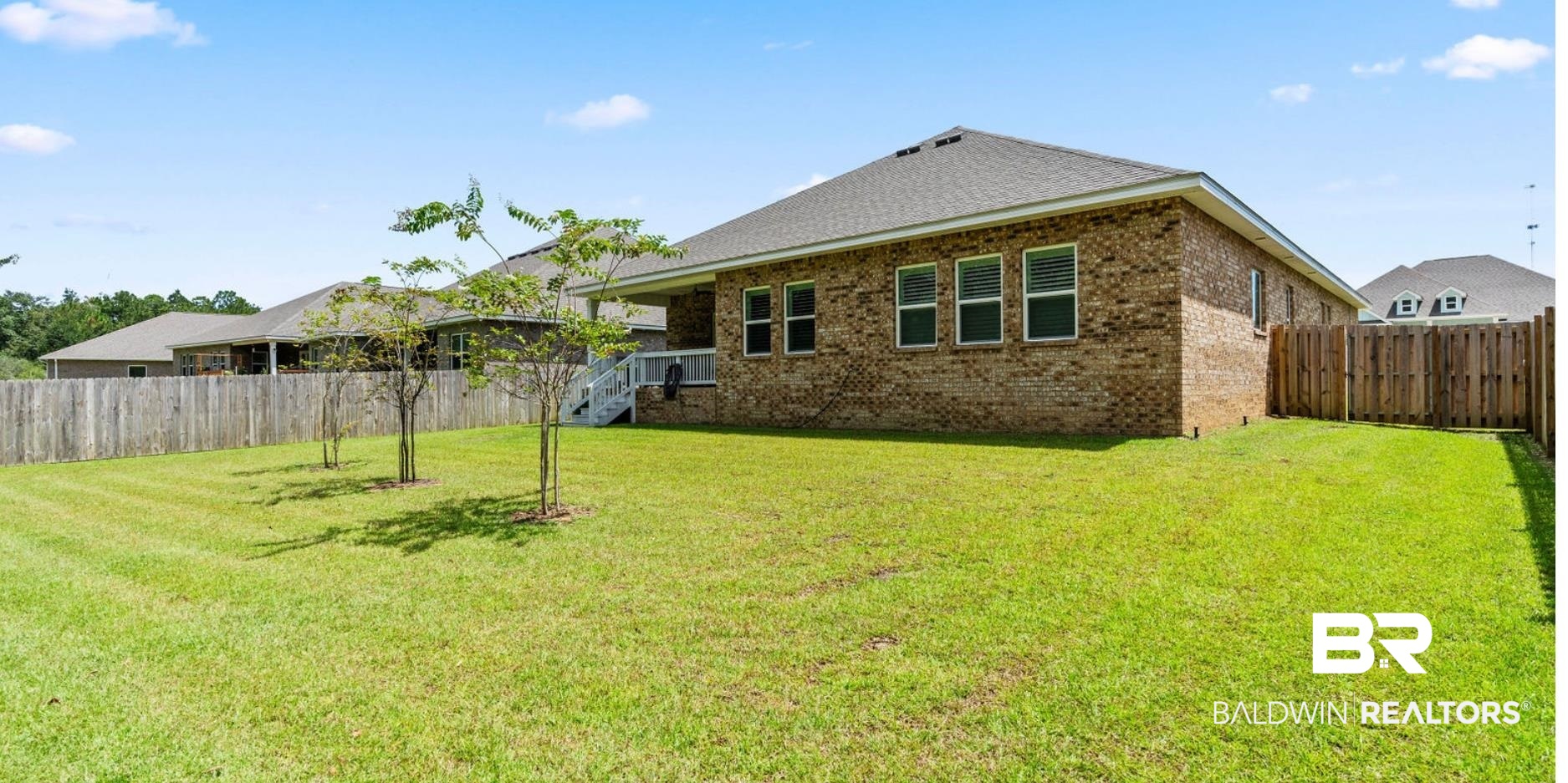 8841 Calverton Street Foley, AL 36535 - Photo 11 of 51 Back of property with a lawn