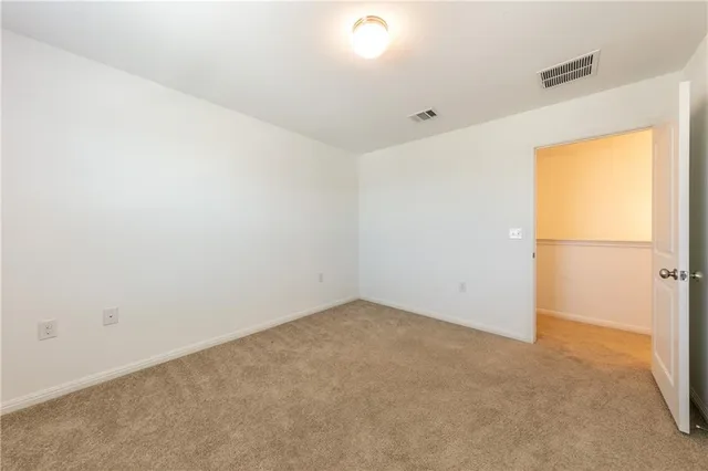 an empty room with kitchen