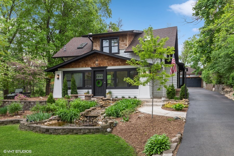 a view of a house with a yard and plants