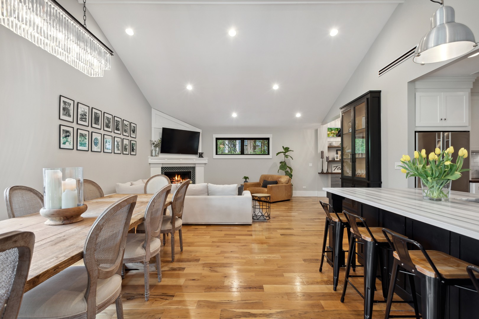 112 Beachway Drive Fox River Grove, IL 60021 - Photo 17 of 37 a living room with furniture kitchen view and a flat screen tv