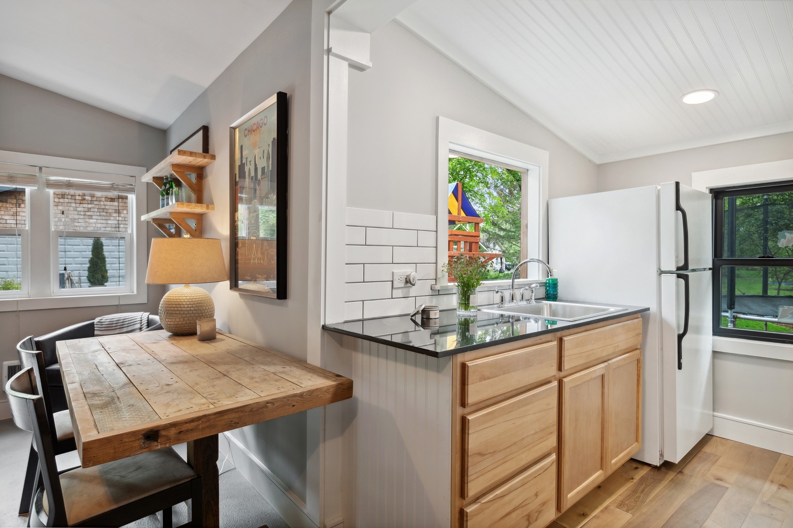 112 Beachway Drive Fox River Grove, IL 60021 - Photo 35 of 37 a kitchen with a sink and chairs