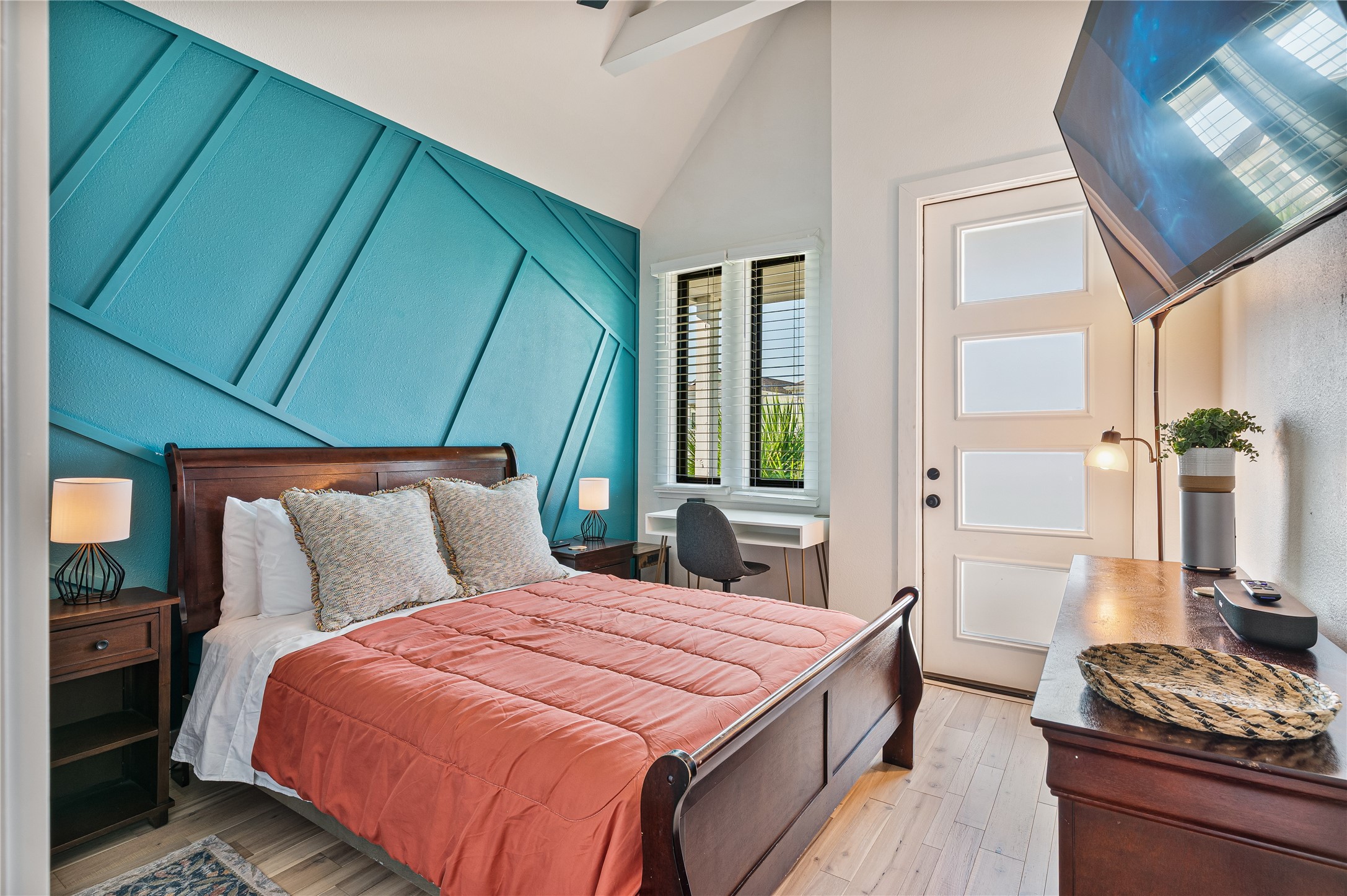 3817 Avenue R Galveston, TX 77550 - Photo 13 of 35 a bedroom with a bed and a dresser