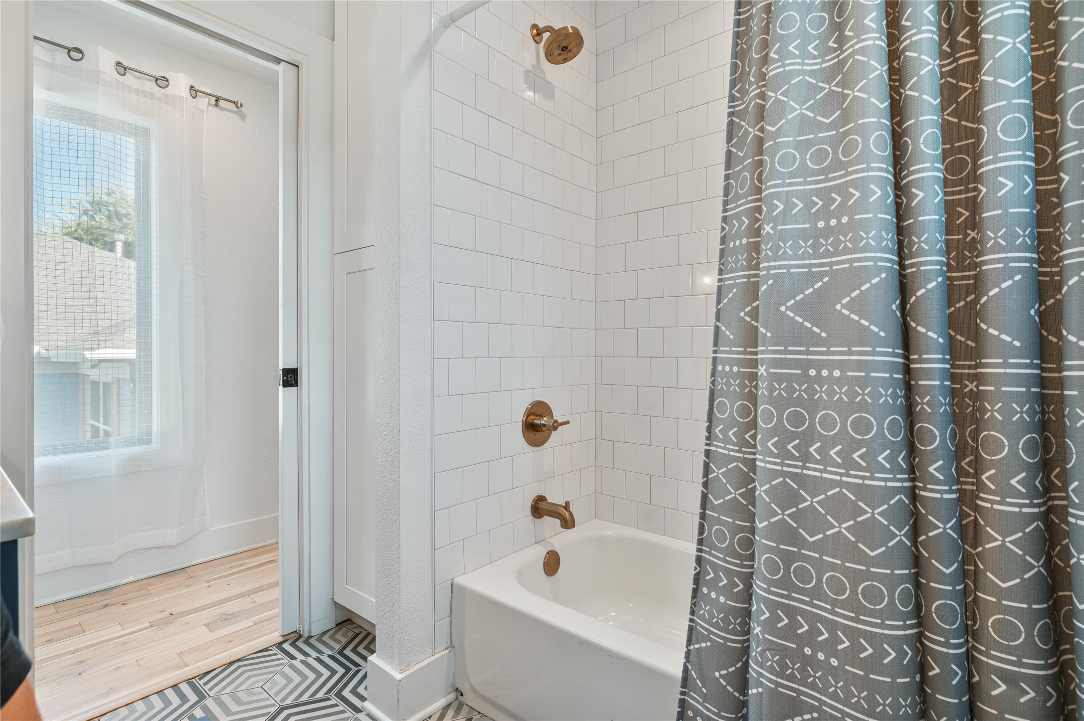 3817 Avenue R Galveston, TX 77550 - Photo 18 of 35 a bathroom with a bathtub and shower