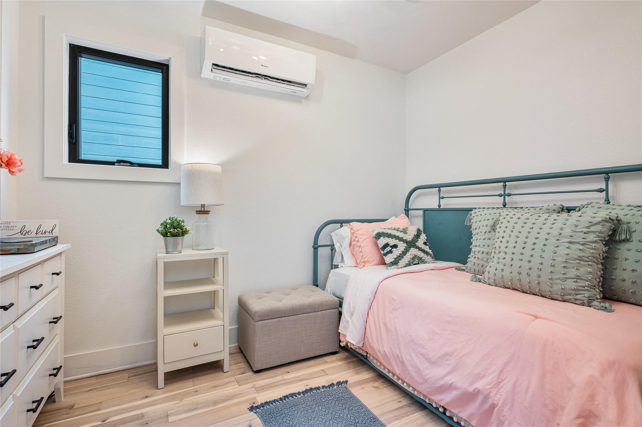 3817 Avenue R Galveston, TX 77550 - Photo 19 of 35 a bedroom with a bed and a dresser