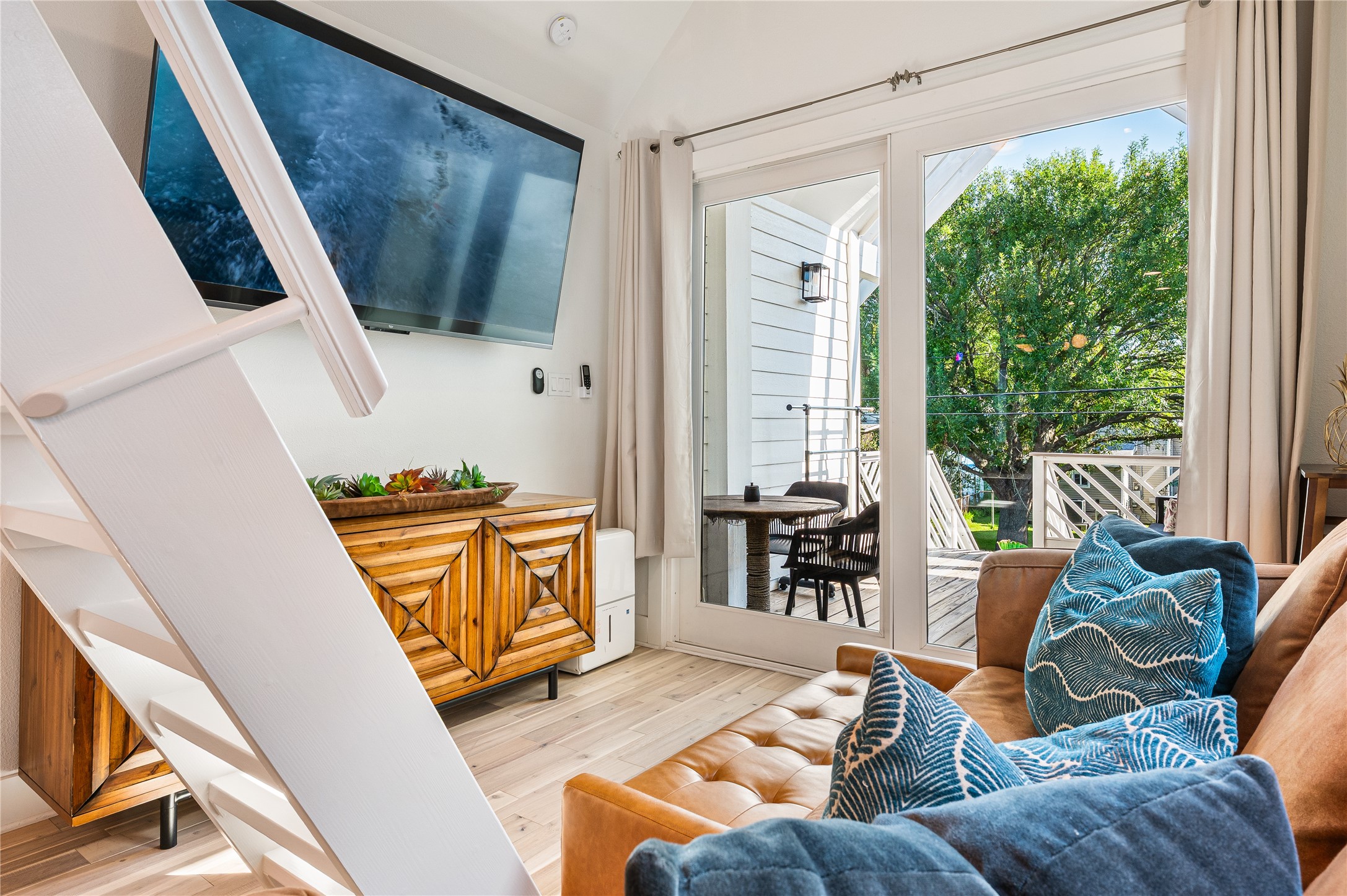 3817 Avenue R Galveston, TX 77550 - Photo 6 of 35 a living room with furniture and a flat screen tv