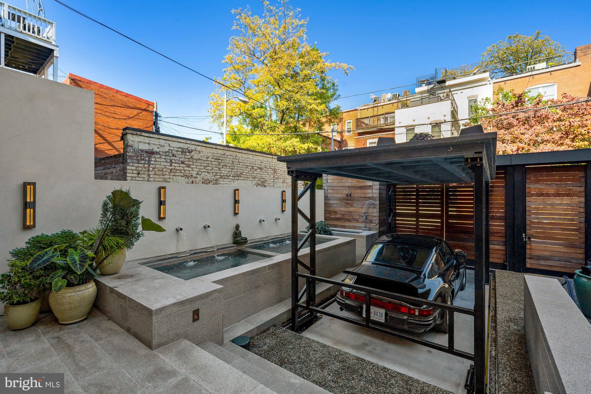 1711 S Street Northwest Washington, DC 20009 - Photo 15 of 50 Car Lift ascends from Underground storage vault