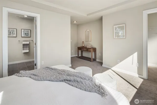 a bedroom with a bed and a cabinets