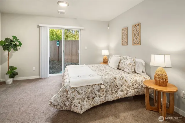 a bedroom with a bed and a dresser in it