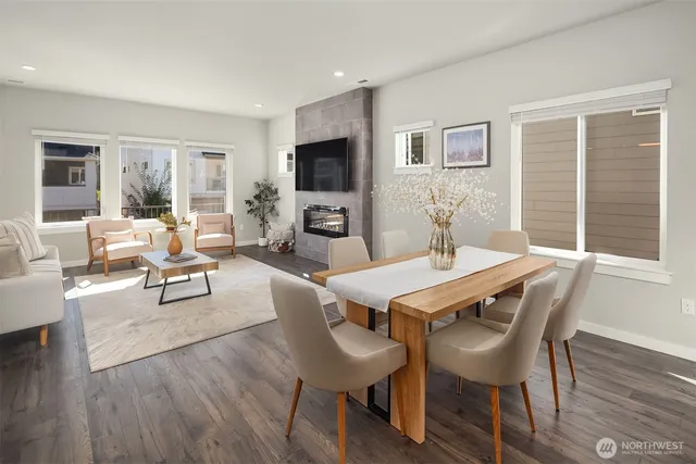a view of a dining room with furniture window and wooden floor