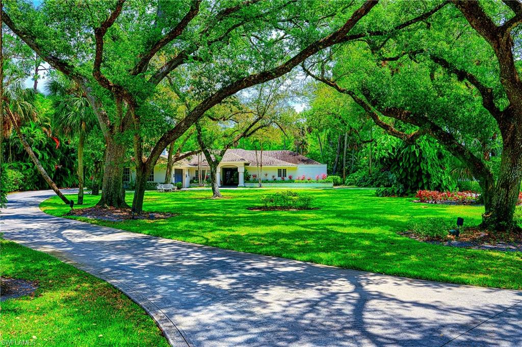 2760 70th Street Southwest Naples, FL 34105 - Photo 1 of 46 Amazing Curb Appeal! Close to all that Naples has to offer on a breathtaking property!