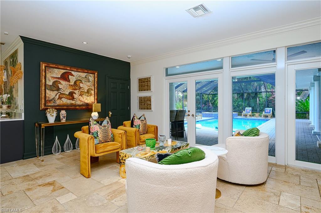 2760 70th Street Southwest Naples, FL 34105 - Photo 13 of 46 Sitting area in Great Room overlooking Pool
