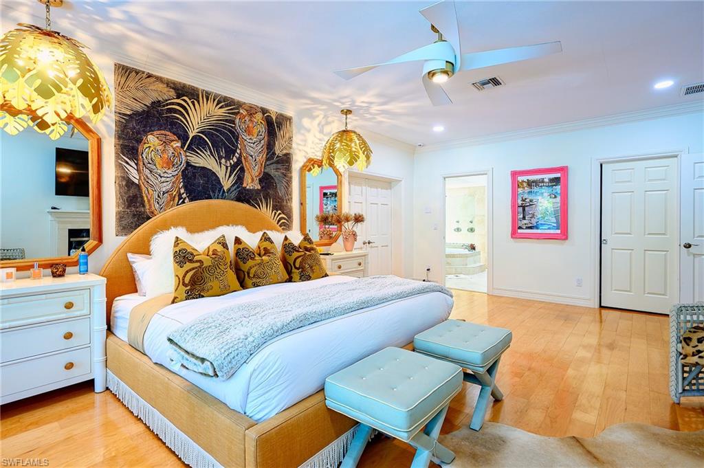 2760 70th Street Southwest Naples, FL 34105 - Photo 19 of 46 Primary Bedroom with walk in closet, bathroom and double door entry into a flex room ideal for home office, Welleness room, home gym etc... Features a sauna