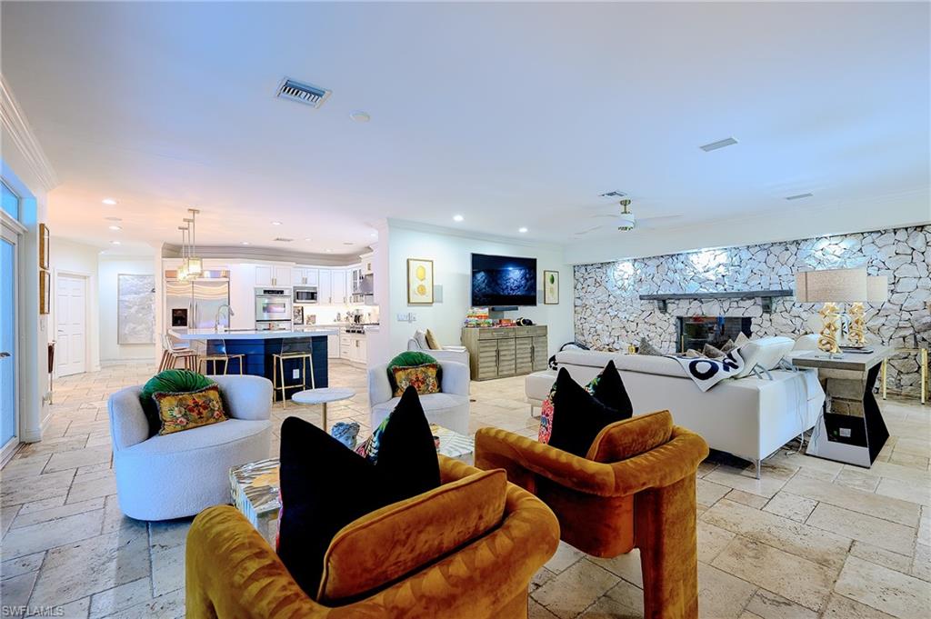 2760 70th Street Southwest Naples, FL 34105 - Photo 3 of 46 Featuring a sitting area, TV area, Dining area and Kitchen - Great Gathering space