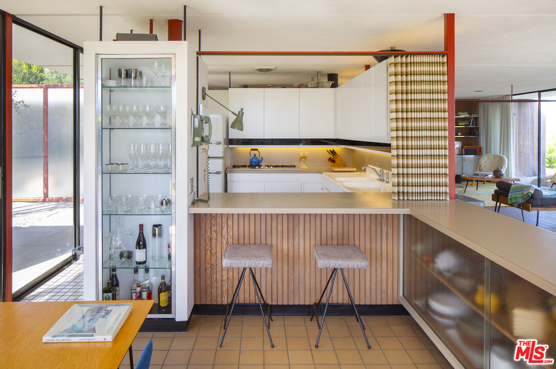 1811 Bel Air Road Los Angeles, CA 90077 - Photo 9 of 28 a bedroom with a bed and a window with outer view