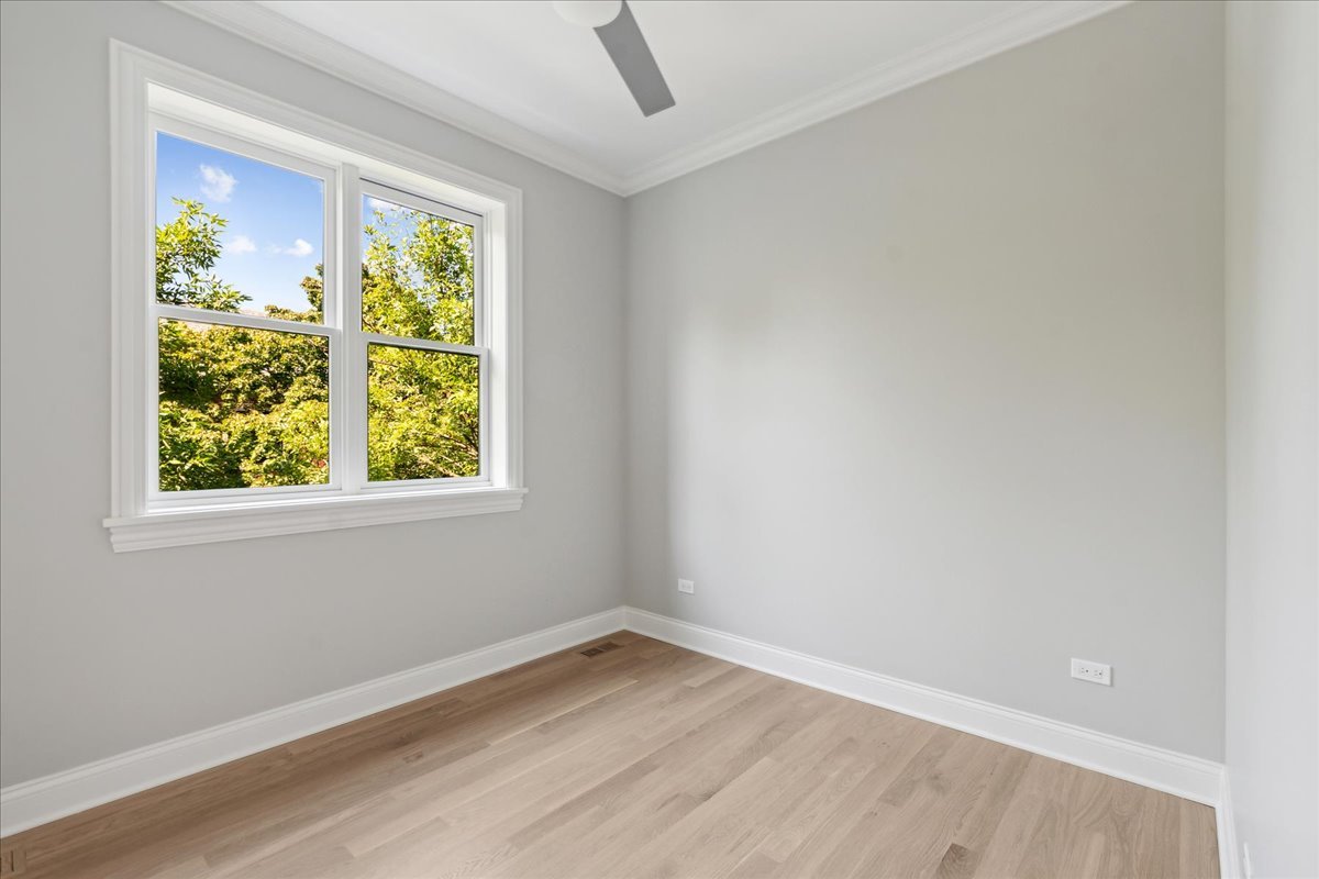 1457 West Roscoe Street, Unit 2 Chicago, IL 60657 - Photo 9 of 16 an empty room with a window