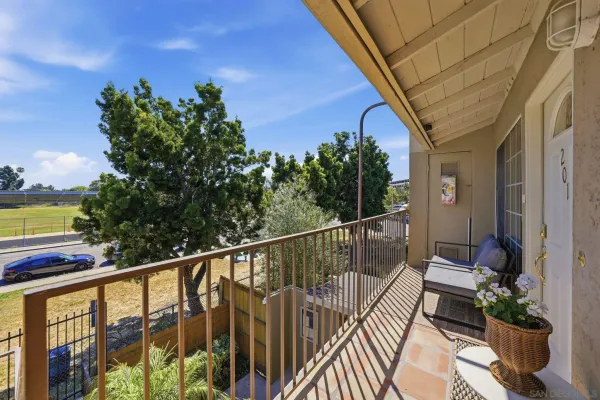 a view of balcony with furniture