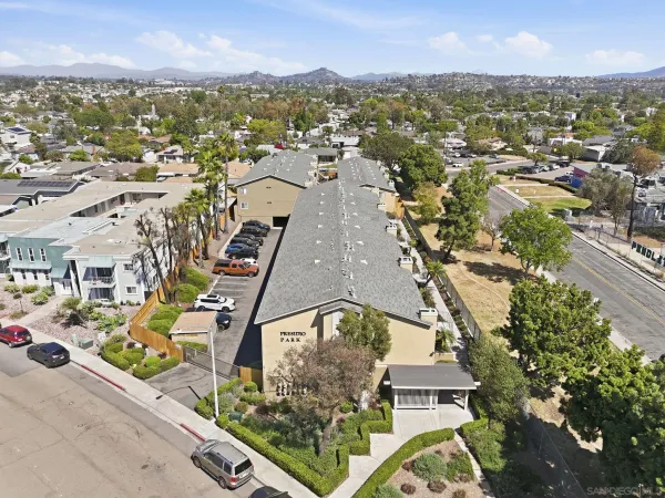 an aerial view of residential houses with outdoor space