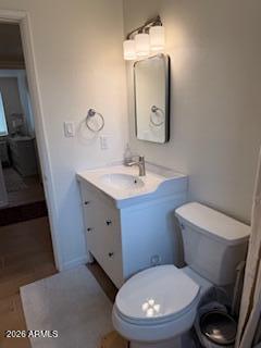 512 West 17th Street Tempe, AZ 85281 - Photo 12 of 13 a bathroom with a toilet a sink and mirror