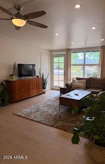 512 West 17th Street Tempe, AZ 85281 - Photo 5 of 13 a living room with a couch a window and a flat screen tv