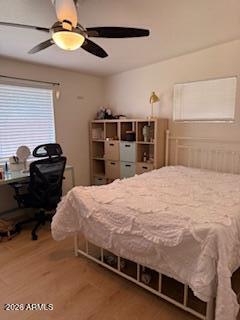 512 West 17th Street Tempe, AZ 85281 - Photo 10 of 13 a bedroom with a bed and a chandelier