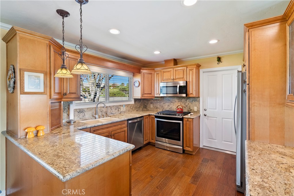 9220 Carmel Road Atascadero, CA 93422 - Photo 14 of 61 The updated kitchen boasts abundant cabinets for storage and wood floors.