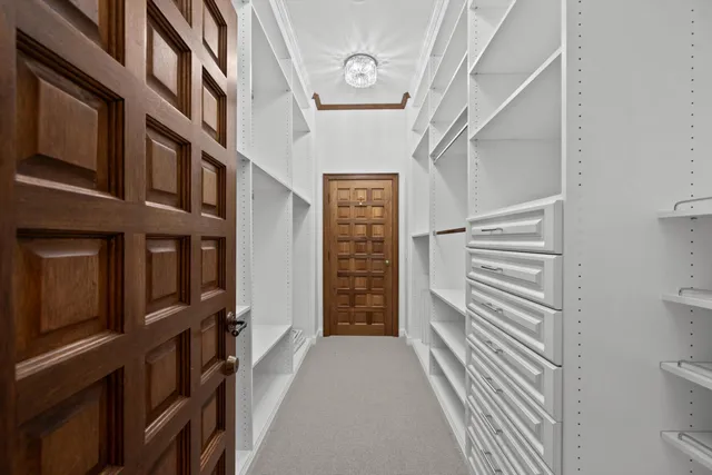 a view of a hallway with seating space