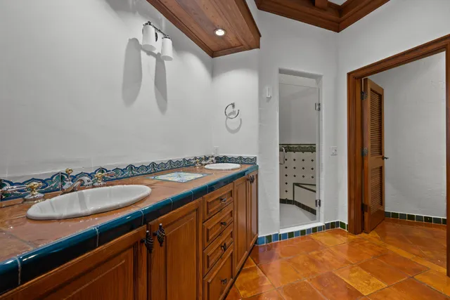 a bathroom with a tub and a window