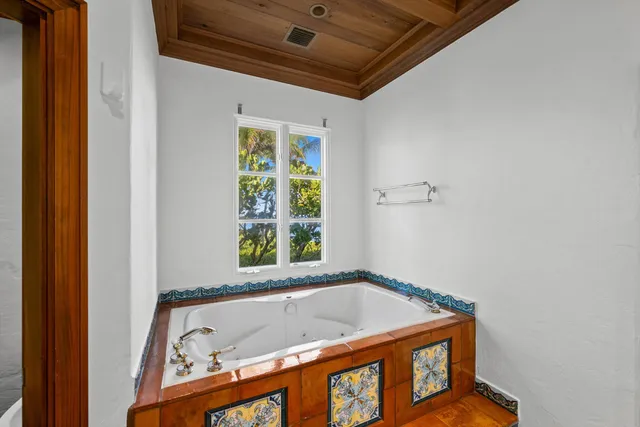 a bedroom with bed and window