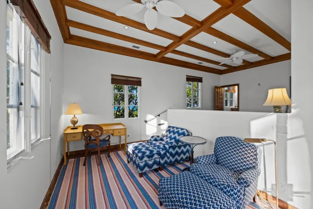 a bedroom with a bed and a lamp on dresser