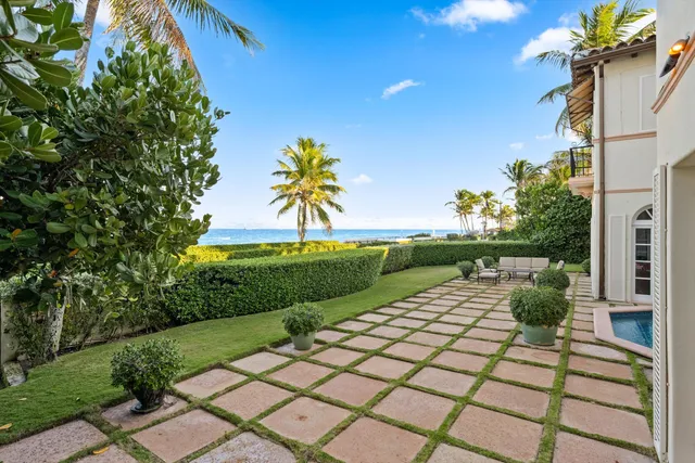 a view of swimming pool with outdoor seating