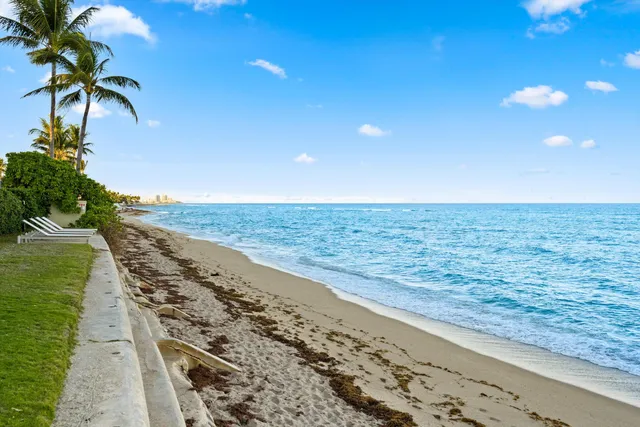 a view of a yard with an ocean view
