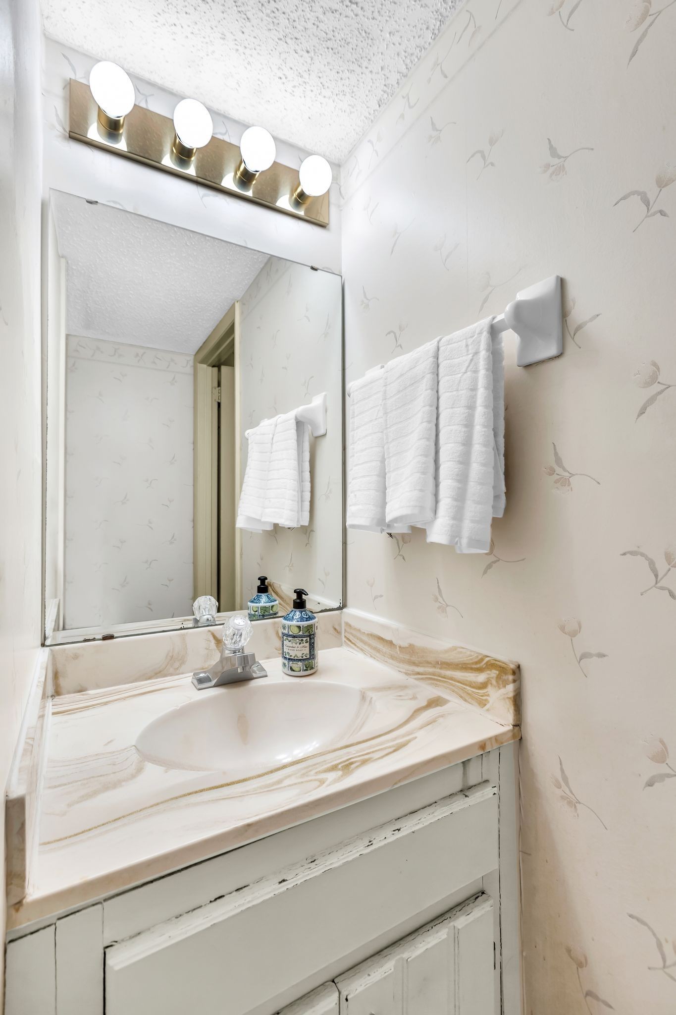 21 Vaughns Gap Road, Unit A22 Nashville, TN 37205 - Photo 22 of 28 a bathroom with a sink and a mirror