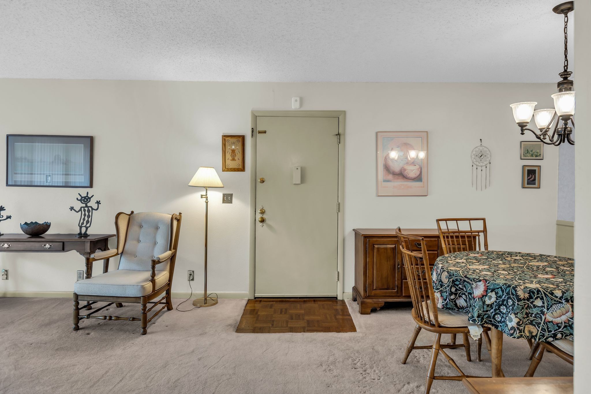 21 Vaughns Gap Road, Unit A22 Nashville, TN 37205 - Photo 10 of 28 a living room with furniture and a chandelier