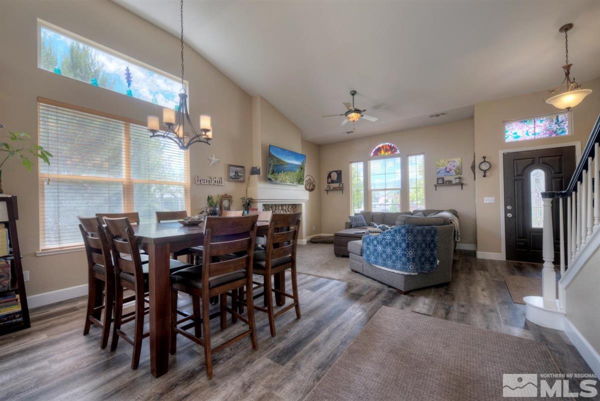 9798 Thunder Mountain Way Reno, NV 89521 - Photo 8 of 27 a view of a dining room with furniture and wooden floor
