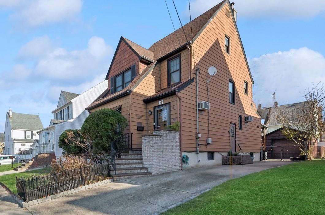 67 Amherst Road Valley Stream, NY 11581 - Photo 1 of 1 a view of a house with a yard