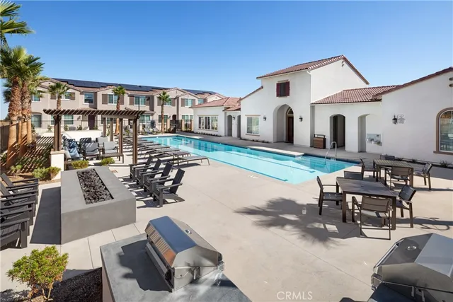 a living room with furniture a rug and a chandelier